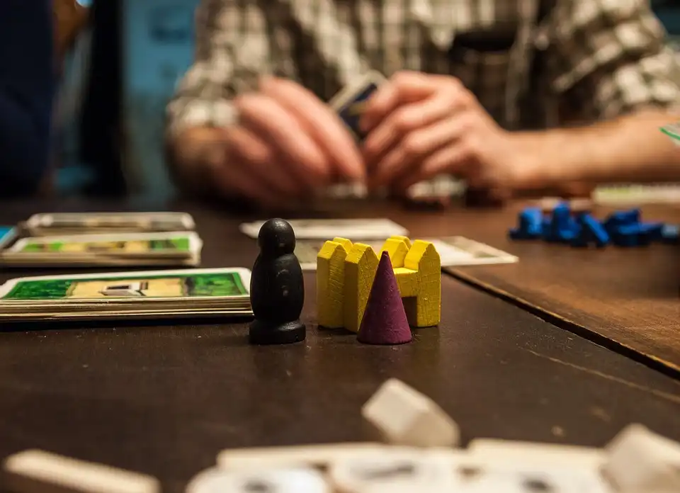 Close up of board game pieces on a table during a game