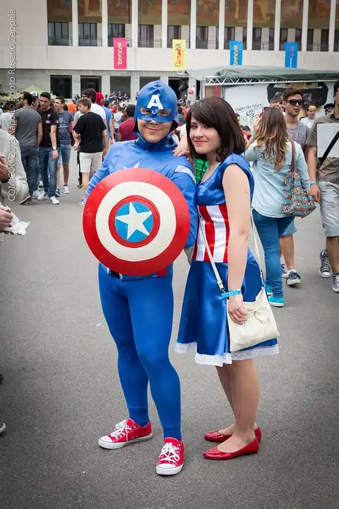 A man and woman in superhero cosplay