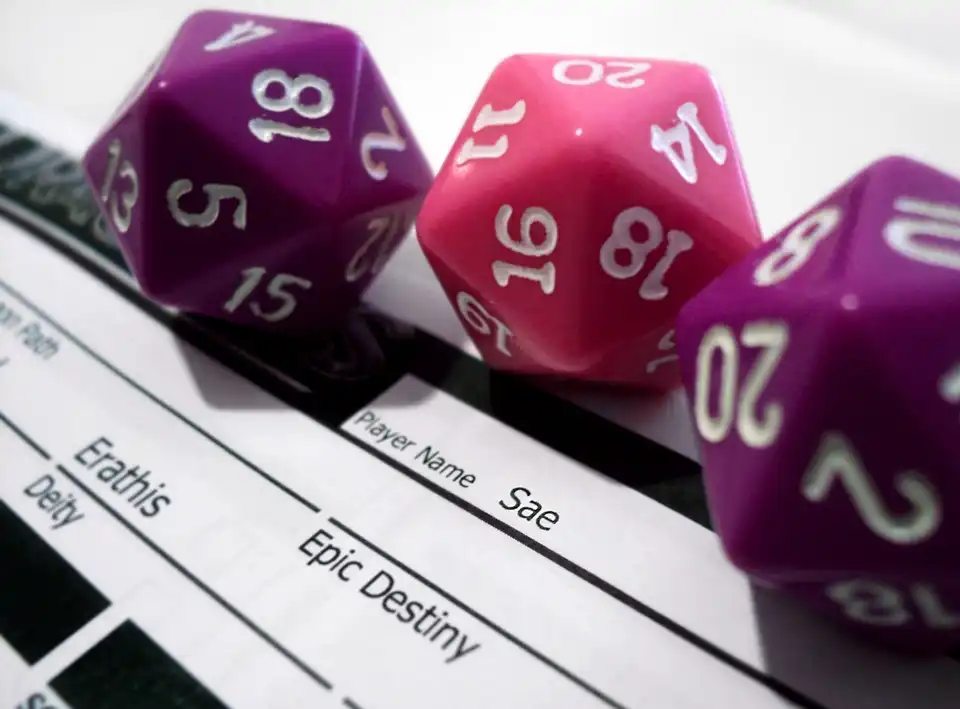 A close up of 3 20-sided dice